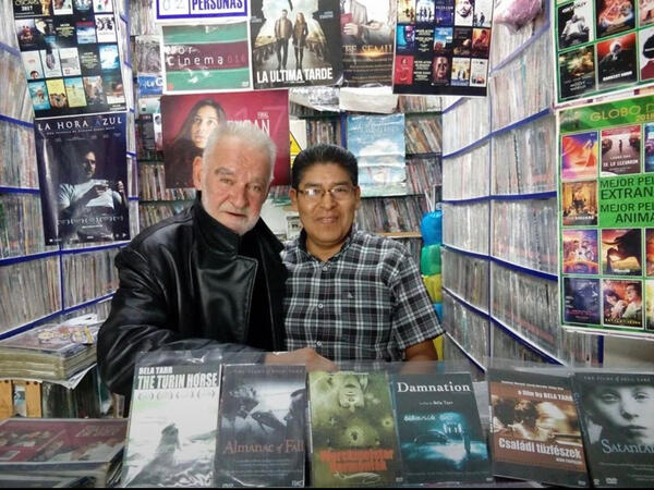 Bela tarr together with a shop merchant selling his bootlegged dvds illegally